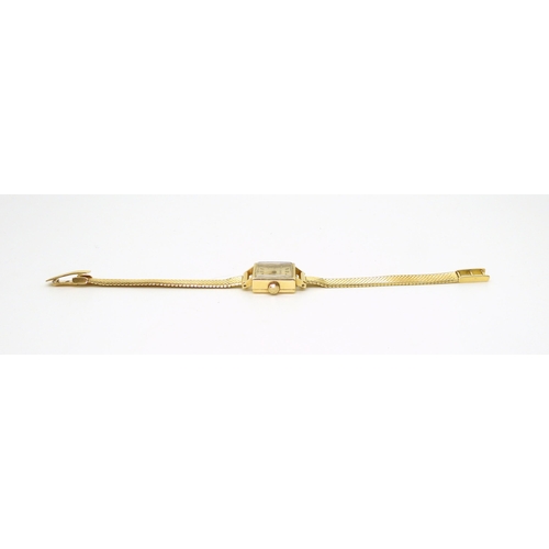 2919 - A LADIES CONSUL WATCHmade in 18ct gold with mesh strap stamped 750. the case is 1.6cm, the strap len... 