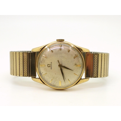 2925 - A GENTS 9CT GOLD OMEGAthe silvered dial has gold baton numerals and dauphin hands, the movement is s... 