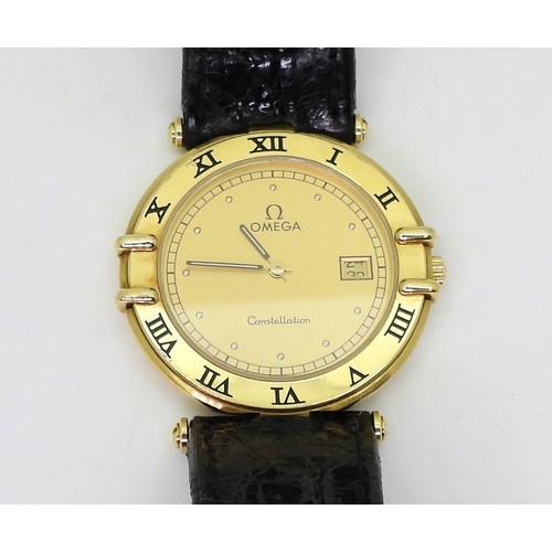 2930 - AN 18CT GOLD OMEGA CONSTELLATIONthe gold coloured dial with date aperture and roman numerals to the ... 