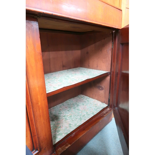 26 - A Victorian mahogany sideboard with carved backsplash over single long drawer over pair of panel doo... 