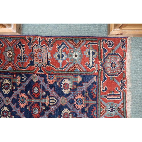 29 - A blue ground Kurdish tribal runner with all-over floral pattern ground and pink geometric border, 2... 