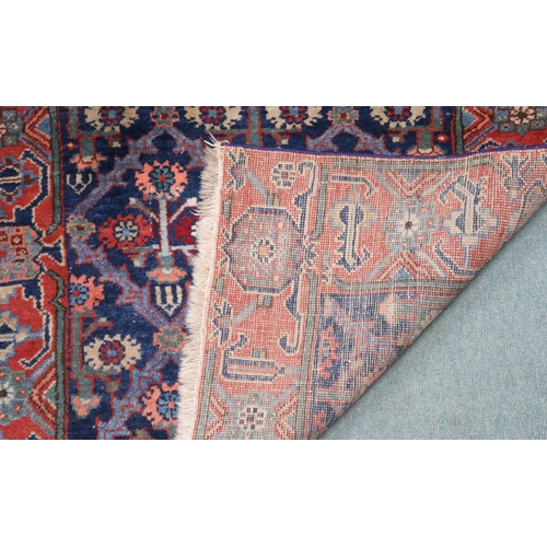 29 - A blue ground Kurdish tribal runner with all-over floral pattern ground and pink geometric border, 2... 