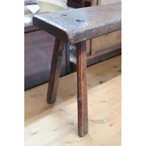 30 - A 19th century elm bench stool with plank seat on chamfered splayed supports, 40cm high x 88cm wide ... 