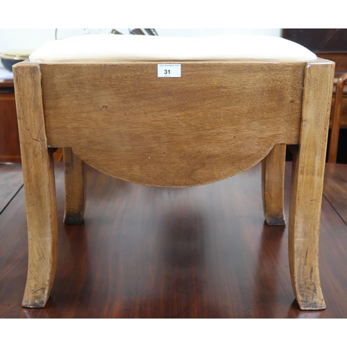 31 - An early 20th century Art Deco style dressing stool with upholstered seat over shaped frieze sides o... 