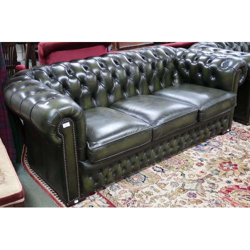 37 - A 20th century forest green leather buttonback upholstered Chesterfield style three seater club sofa... 