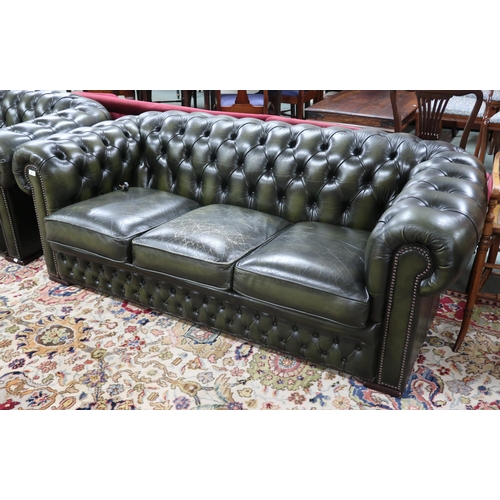 38 - A 20th century forest green leather buttonback upholstered Chesterfield style three seater club sofa... 