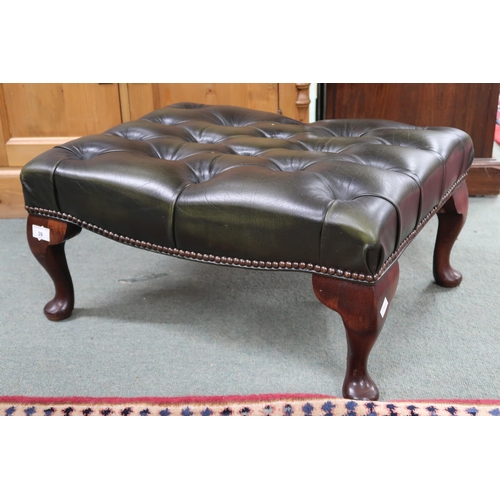 39 - A 20th century forest green leather button upholstered footstool on cabriole supports, 30cm high x 6... 