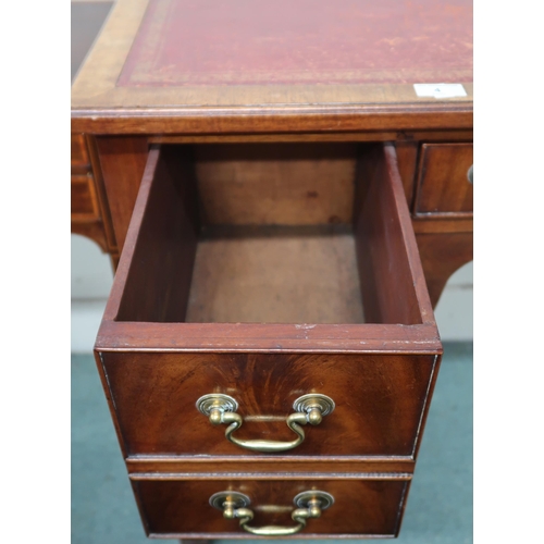 4 - A 19th century mahogany low boy style desk with red skiver over central drawer flanked by two drawer... 