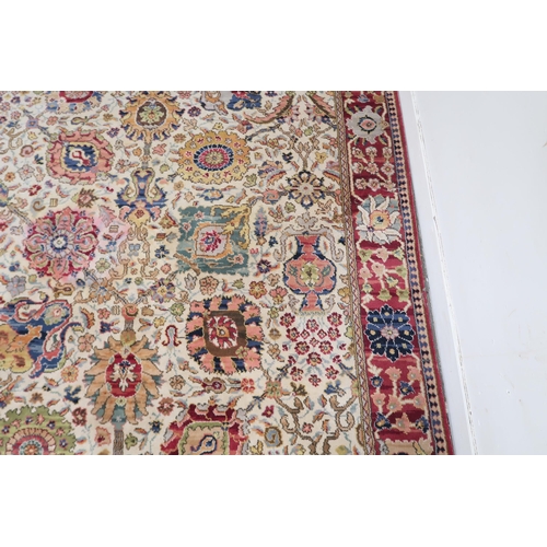 40 - A cream ground James Templeton & Co Ltd carpet with all over floral patterned ground and red flo... 