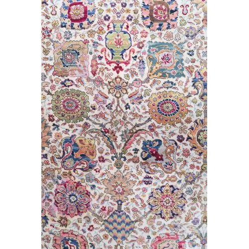 40 - A cream ground James Templeton & Co Ltd carpet with all over floral patterned ground and red flo... 