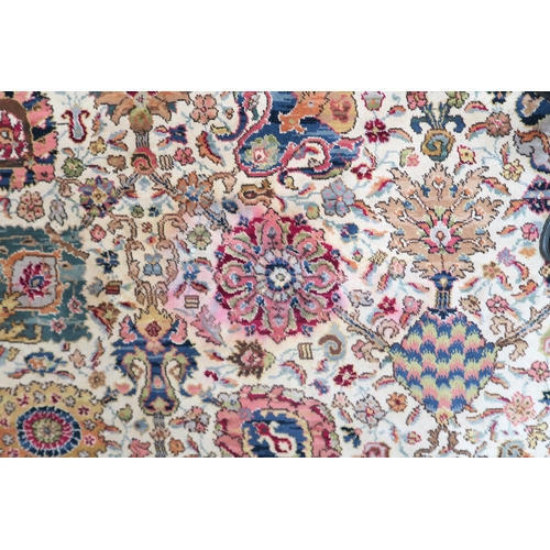 40 - A cream ground James Templeton & Co Ltd carpet with all over floral patterned ground and red flo... 