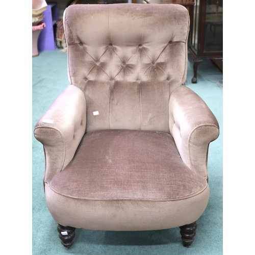 64 - A Victorian buttonback upholstered armchair on turned supports, 88cm high x 74cm wide x 85cm deep, a... 