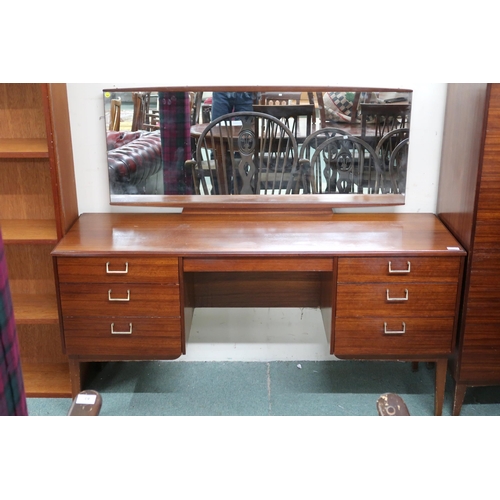 75 - A mid 20th century teak Lebus three piece bedroom suite comprising mirror back dressing table, 118cm... 