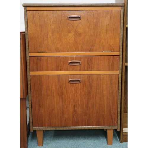 79 - A small mid 20th century teak drinks cabinet with fall front compartment with mirrored interior over... 