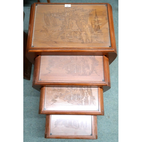 88 - A lot comprising 20th century Oriental hardwood nest of four tables with carved tops under glass on ... 