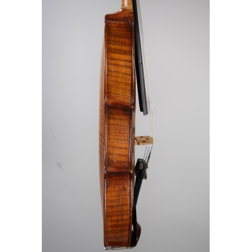 A two piece back violin 35cm bearing label to the interior