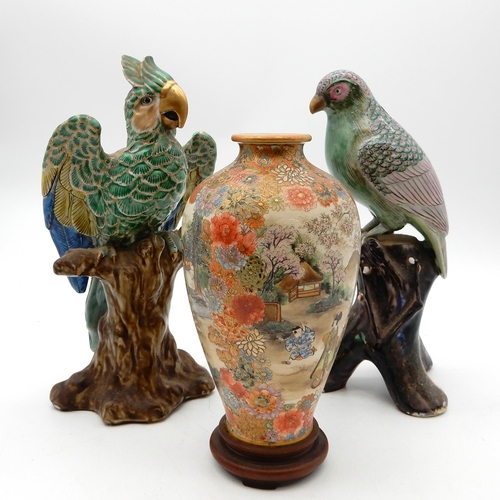 2370A - A Japanese export porcelain parrot, decorated in shades of blue, green and pink, modelled on a natur... 