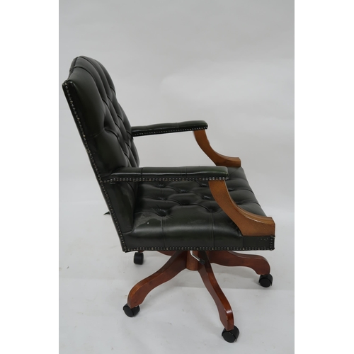 102 - A contemporary buttonback upholstered swivel desk chair, 99cm high x 59cm wide x 70cm deep