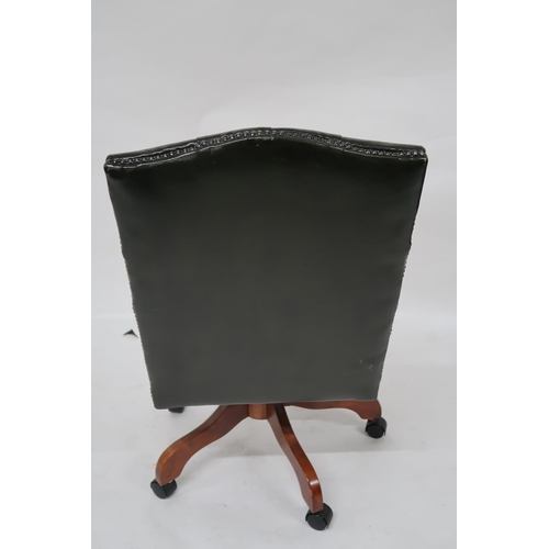 102 - A contemporary buttonback upholstered swivel desk chair, 99cm high x 59cm wide x 70cm deep