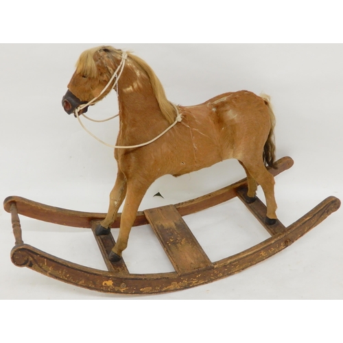 93 - A 19th century children's rocking horse, hide covered main body with horse hair main and tail on elm... 