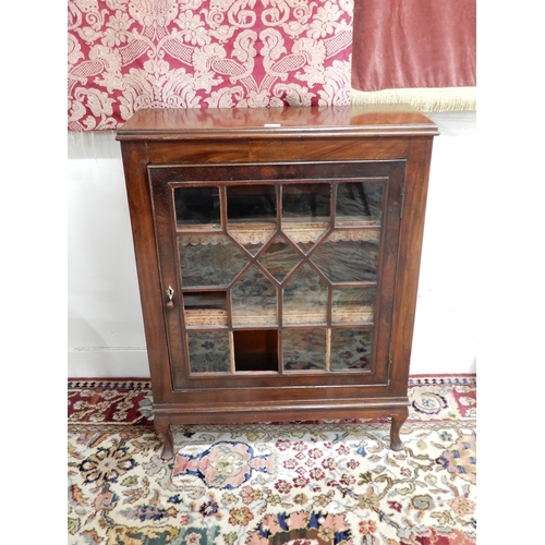 95 - A Victorian mahogany astragal glazed pier cabinet with single door concealing two shelves with embos... 