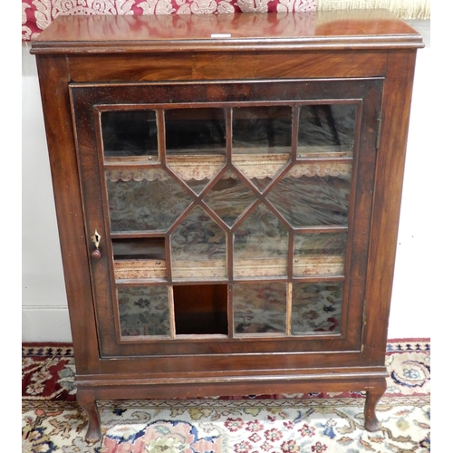 95 - A Victorian mahogany astragal glazed pier cabinet with single door concealing two shelves with embos... 