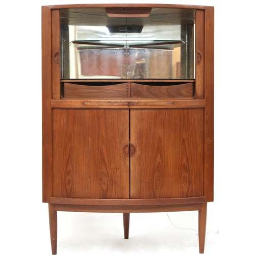 2105A - A MID 20TH CENTURY DANISH TEAK JOHANNES ANDERSEN BOW TAMBOUR FRONTED CORNER DRINKS CABINET with... 