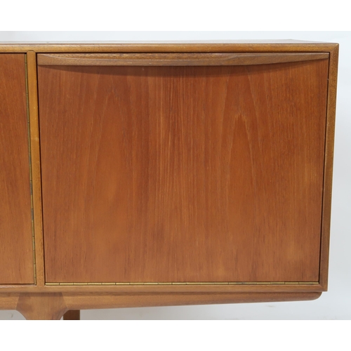2107A - A MID 20TH CENTURY TEAK MCINTOSH & CO LTD OF KIRKCALDY SIDEBOARD with pair of central doors... 
