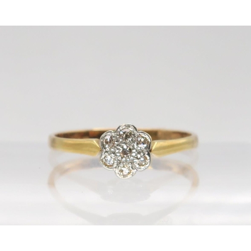 709 - An 18ct gold diamond flower ring set with estimated approx 0.15cts of eight cut diamonds, finger siz... 