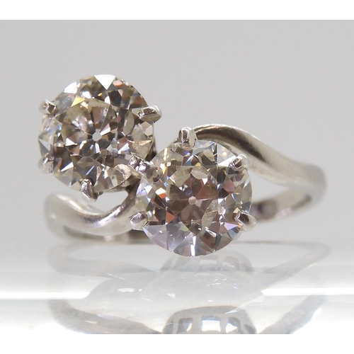 732 - A substantial twin stone diamond ring, set with two old cut diamonds with an estimated approx diamon... 