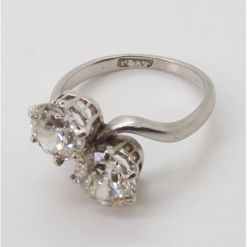 732 - A substantial twin stone diamond ring, set with two old cut diamonds with an estimated approx diamon... 