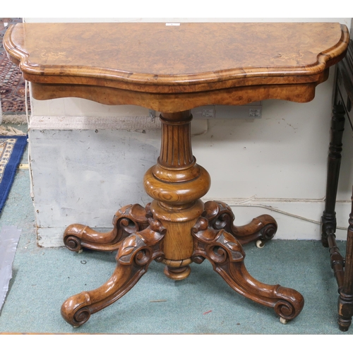 1 - A Victorian burr walnut and satinwood inlaid serpentine front fold-over tea table on turned baluster... 