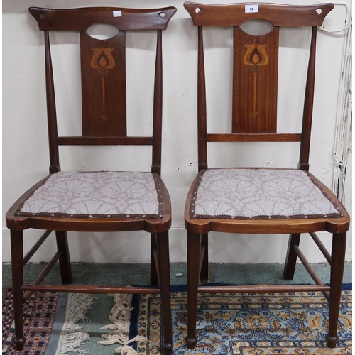 14 - A pair of late Victorian mahogany framed Art Nouveau chairs with pierced samplewood inlaid back rest... 