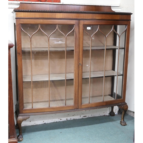 21 - An early 20th century mahogany display cabinet with gadrooned top of pair of glazed doors on cabriol... 
