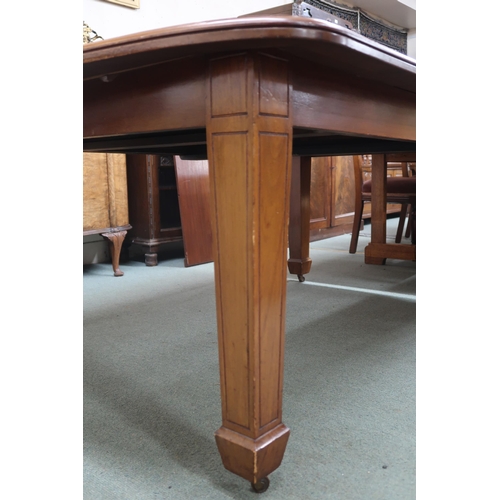 26 - A Victorian mahogany wind out extending dining table on square tapering supports terminating in cast... 