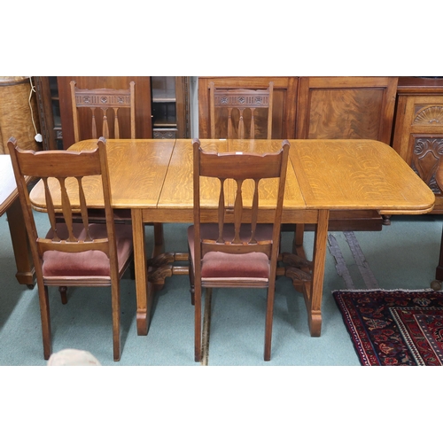 32 - A 20th century oak extending dining table with two internal leaves on pair of trestle supports joine... 