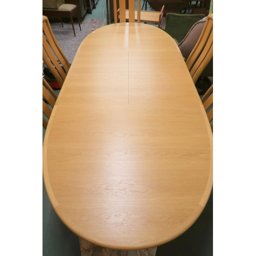 52 - A 20th century Danish teak Skovby dining suite consisting oval extending dining table with internal ... 