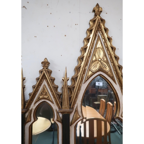 53 - A 20th century gilt framed ecclesiastical style wall mirror with large shaped bevelled glass mirror ... 