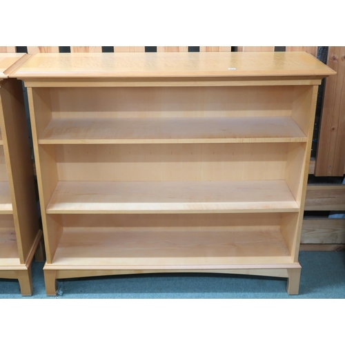 83 - A pair of Northcroft contemporary teak and birdseye maple veneered open bookcases, 91cm high x 106cm... 