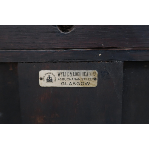 24 - A 20th century oak Wylie & Lochhead kitchen dresser with two tier plate rack over pair of drawer... 