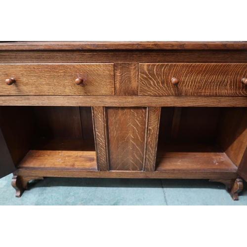 24 - A 20th century oak Wylie & Lochhead kitchen dresser with two tier plate rack over pair of drawer... 