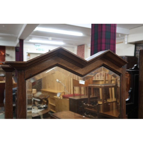 40 - A late Victorian oak dressing chest with adjustable mirror on drawered superstructure on base with t... 