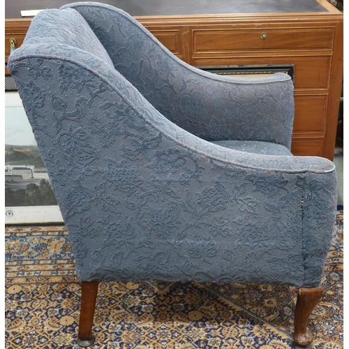 42 - A 20th century blue floral upholstered armchair with cabriole supports, 88cm long x 76cm wide x 71cm... 