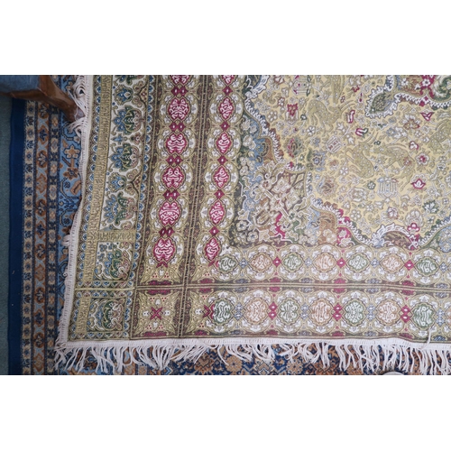 44 - A yellow ground Tabriz style throw with multicoloured central medallion on ground decorated with ani... 