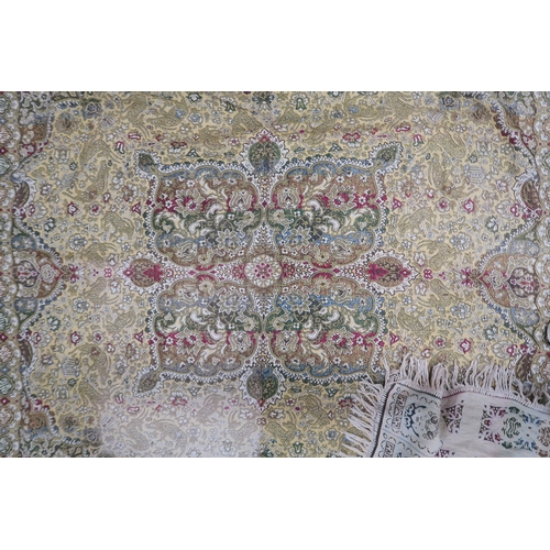 44 - A yellow ground Tabriz style throw with multicoloured central medallion on ground decorated with ani... 