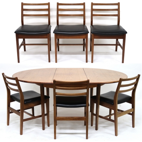 2102 - A MID 20TH CENTURY TEAK EXTENDING DINING TABLE AND SIX CHAIRS with circular extending top over inter... 