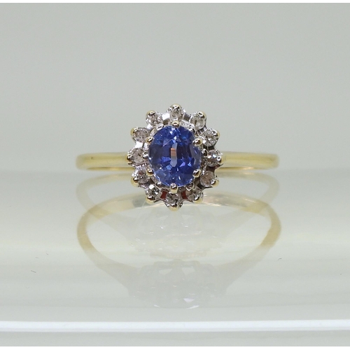 701 - A 9ct gold sapphire and diamond cluster ring, finger size J, weight 1.5gms