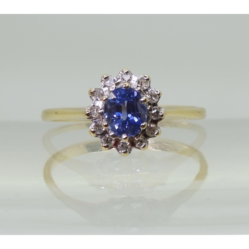 701 - A 9ct gold sapphire and diamond cluster ring, finger size J, weight 1.5gms