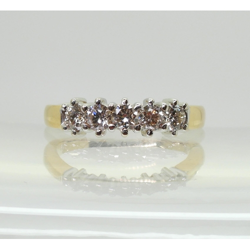 702 - An 18ct gold diamond five stone ring, set with estimated approx 0.50cts of brilliant cut diamonds, f... 