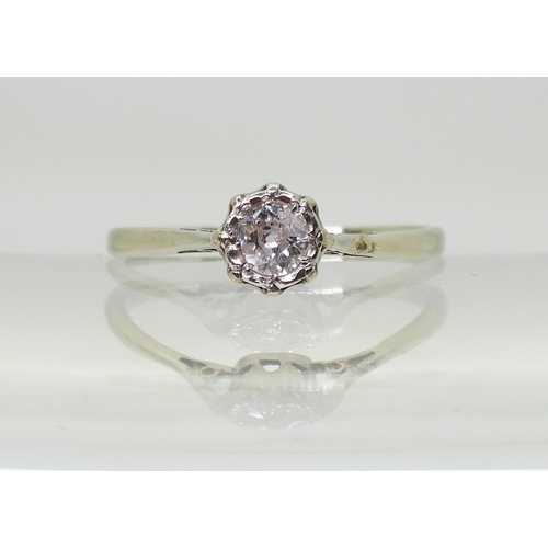 704 - An old cut diamond solitaire in a classic white metal crown mount, the diamond is estimated approx 0... 